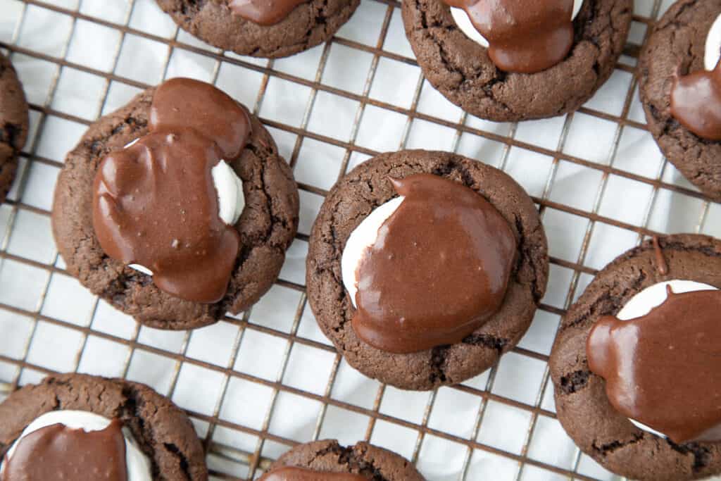 chocolate marshmallow cookies on a wire rack.