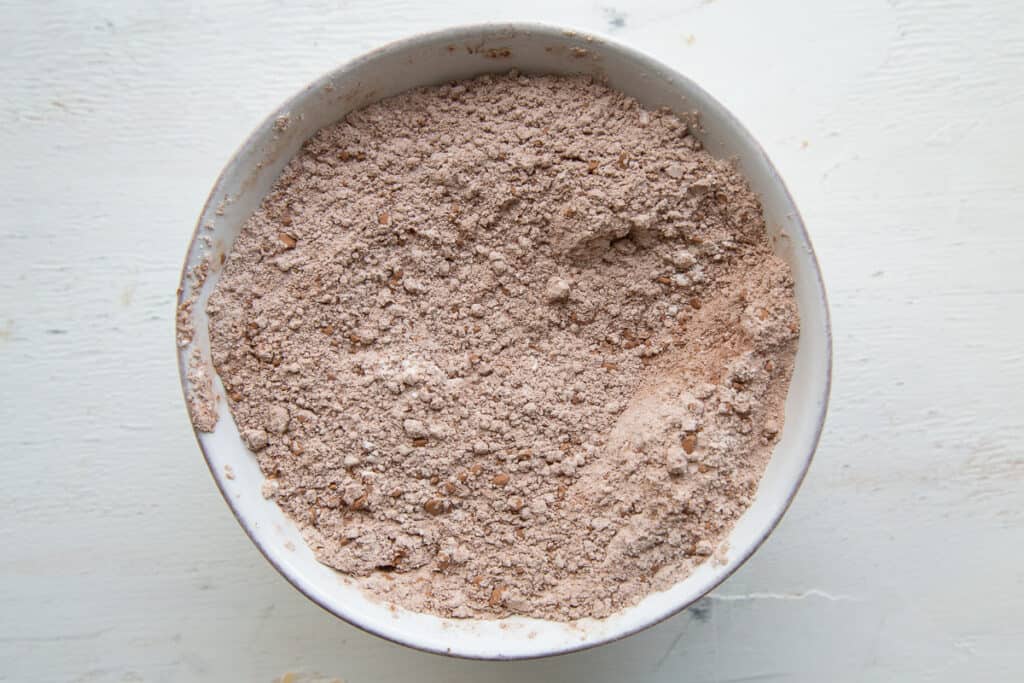 cocoa powder and flour in a white bowl.