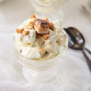 snickers salad in a glass parfait cup.