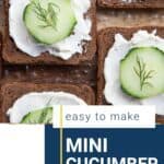 mini open faced cucumber sandwiches topped with fresh dill on a glass platter.