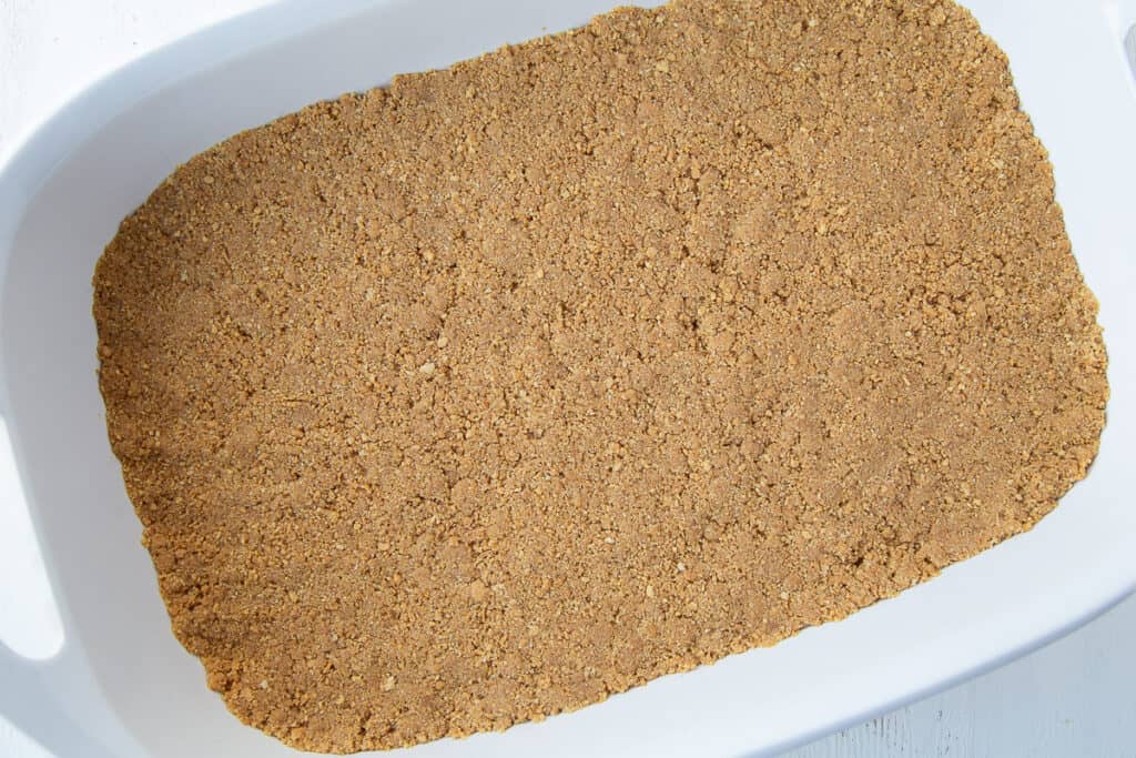 graham cracker crust in a white 13x9 inch pan.