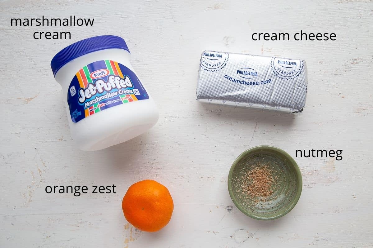 ingredients for fruit dip on a white table.