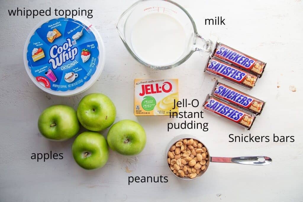 ingredients for snickers salad on a white table.