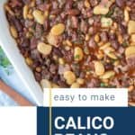 calico beans in a rectangular white dish.