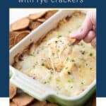 hand scooping reuben dip from a casserole dish.