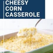cheesy corn casserole in a green casserole dish.