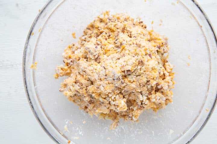cheese log ingredients in a glass bowl.