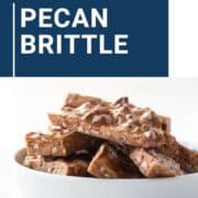 pecan brittle stacked in a white dish.