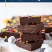 stack of marshmallow fudge pieces on a white platter.