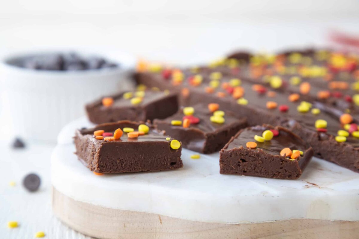 pieces of marshmallow fudge on a white marble platter.