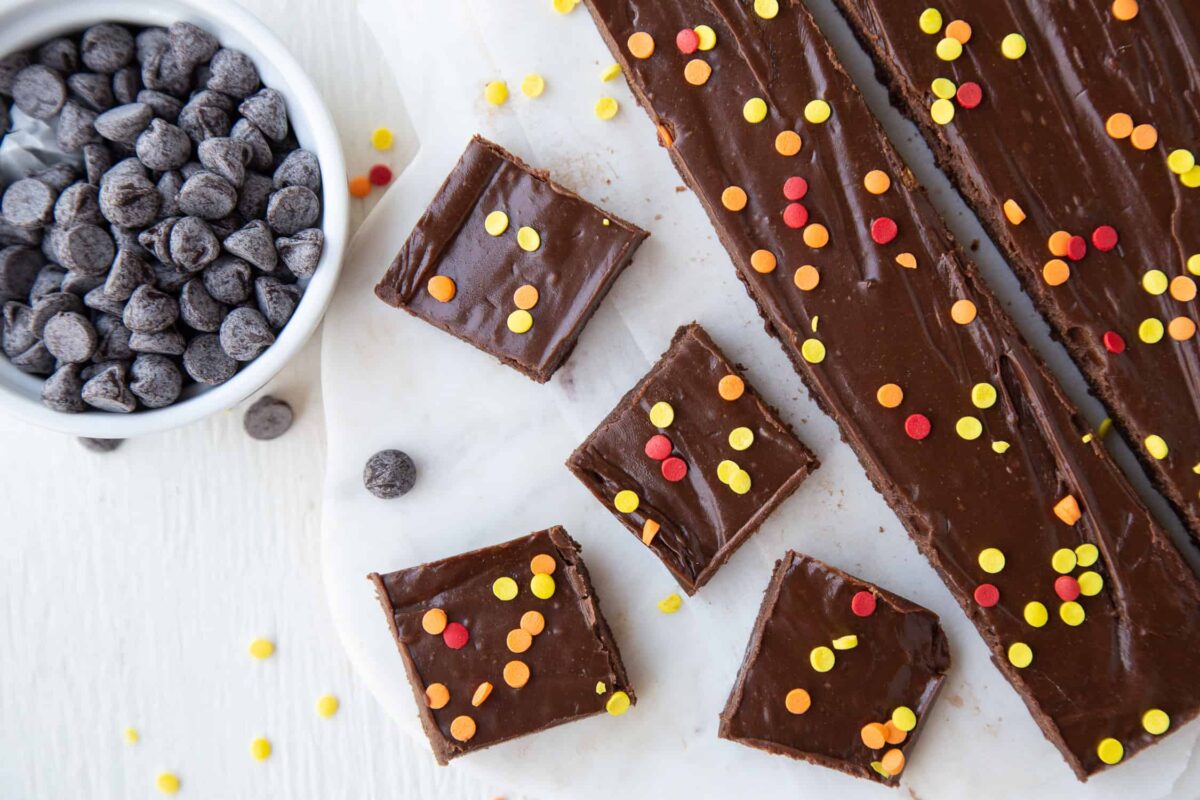 marshmallow fudge decorated with red, yellow, and orange sprinkles, cut into squares.