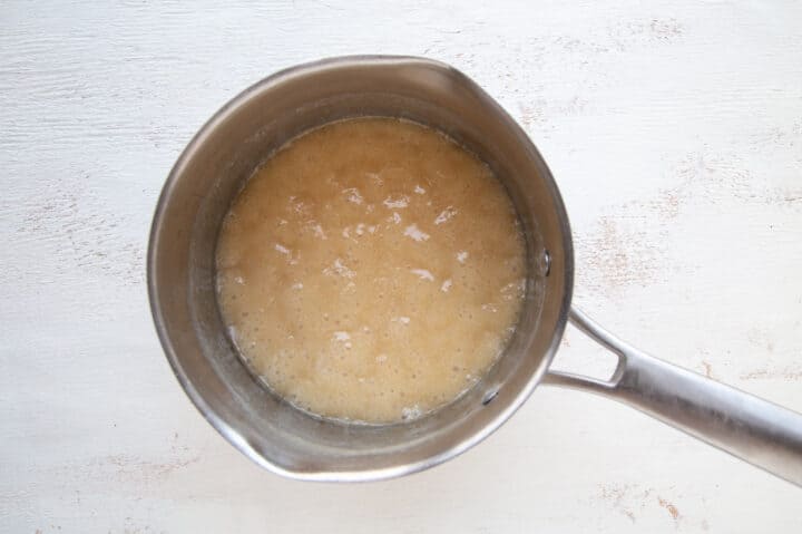 sugar and butter boiling in a saucepan.