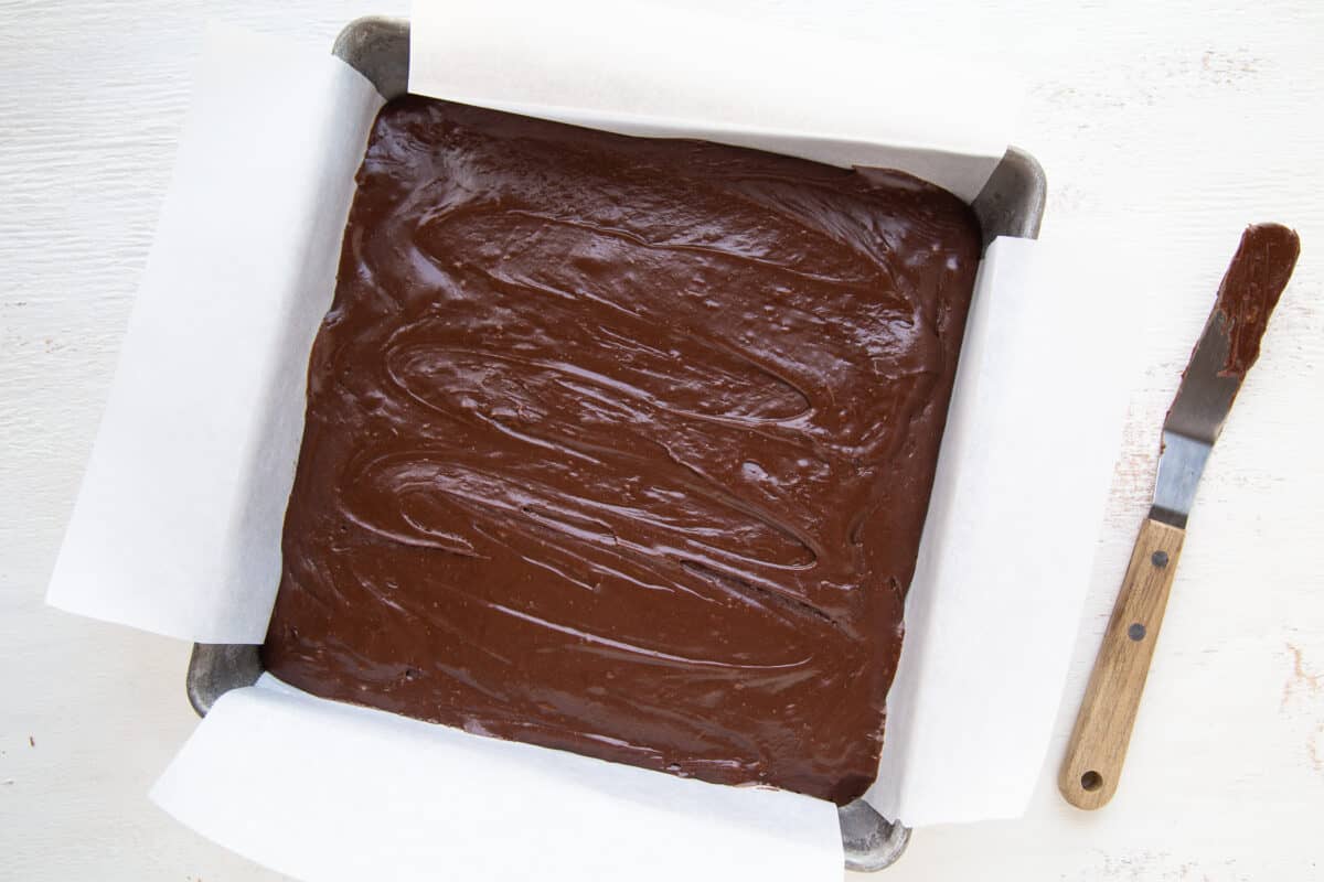 pan of plain marshmallow fudge with an offset spatula next to it.