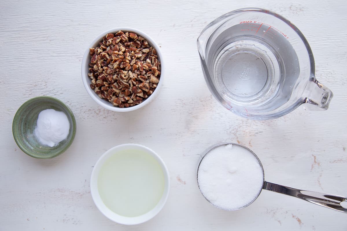 ingredients for pecan brittle on a white table.