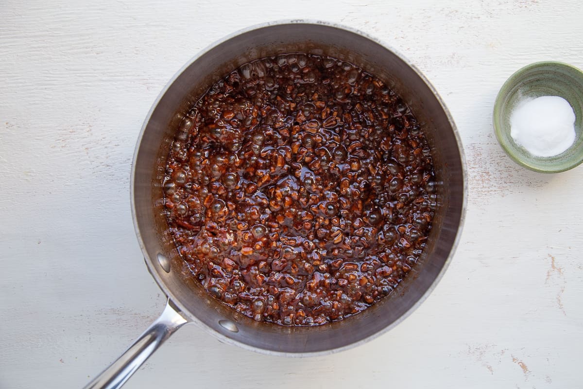 pecans, sugar, and water in a saucepan.