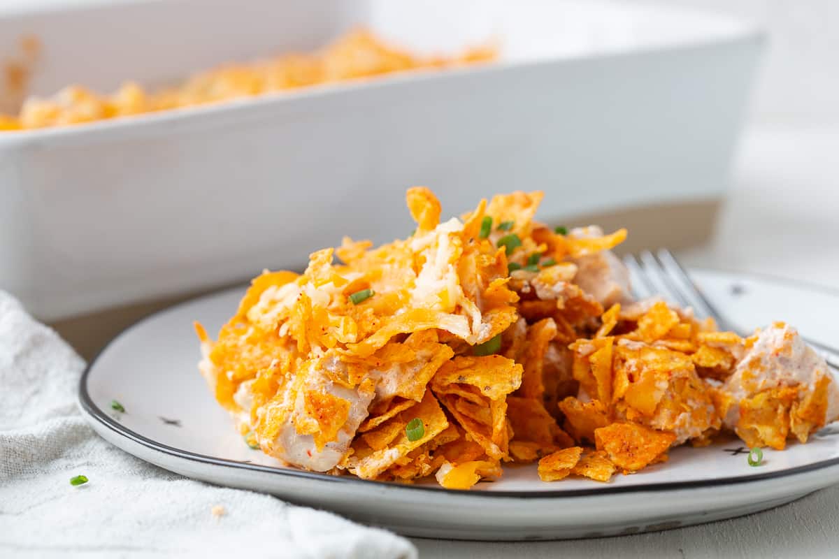 slice of dorito chicken casserole on a white plate.