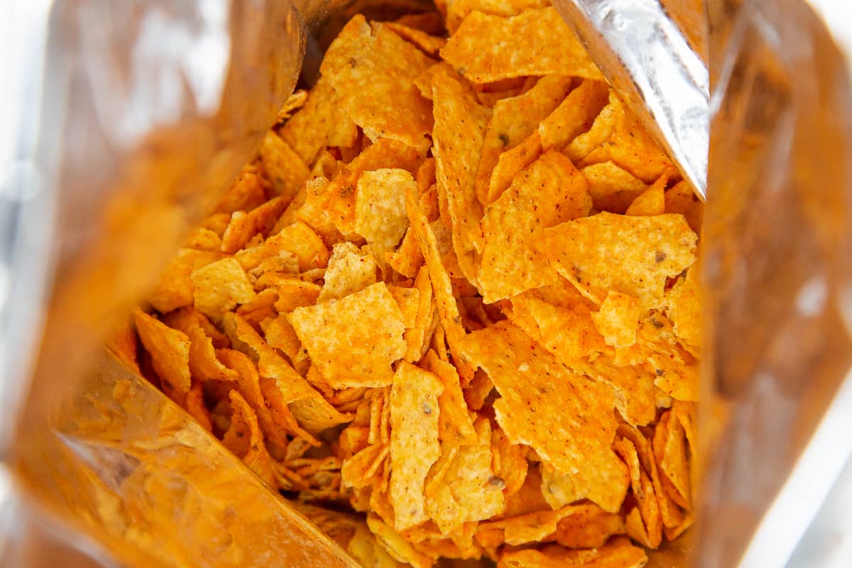 crushed doritos inside the dorito bag.