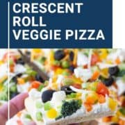 hand holding a slice of crescent roll veggie pizza.