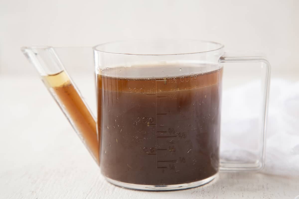 gravy separator holding beef broth and juices.