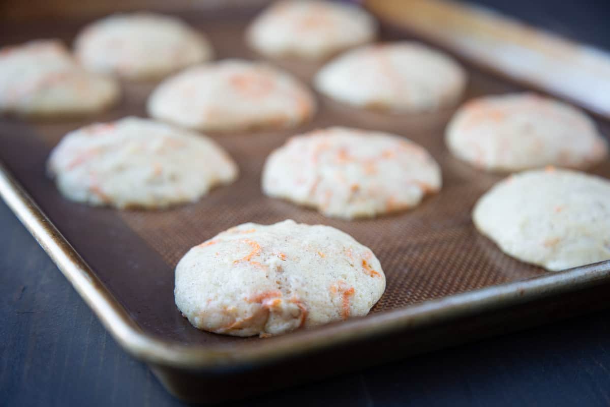 baked flat carrot cakes on a baking sheet.