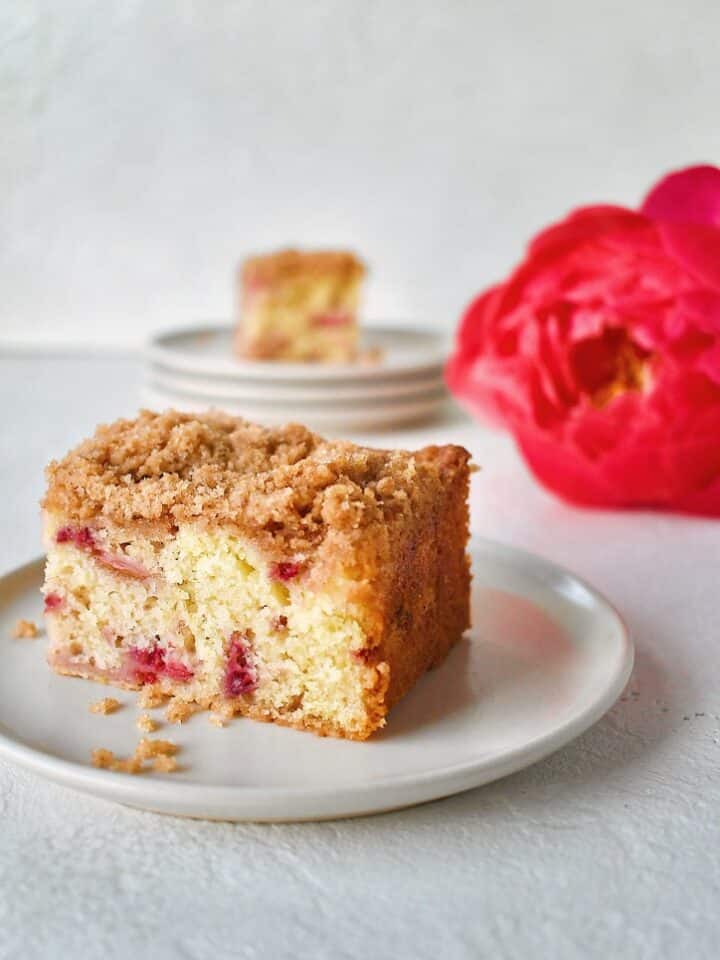 slice of rhubarb buckle on a white plate.