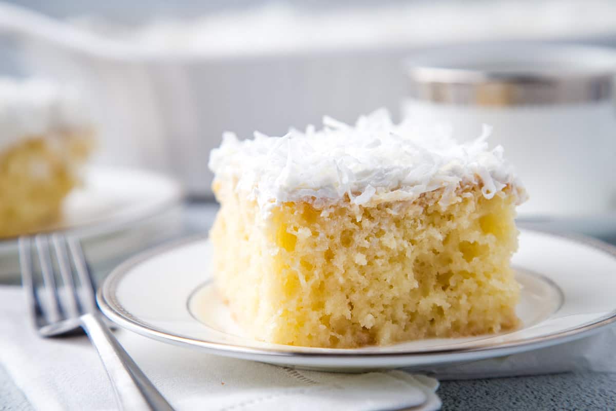 slice of coconut poke cake.