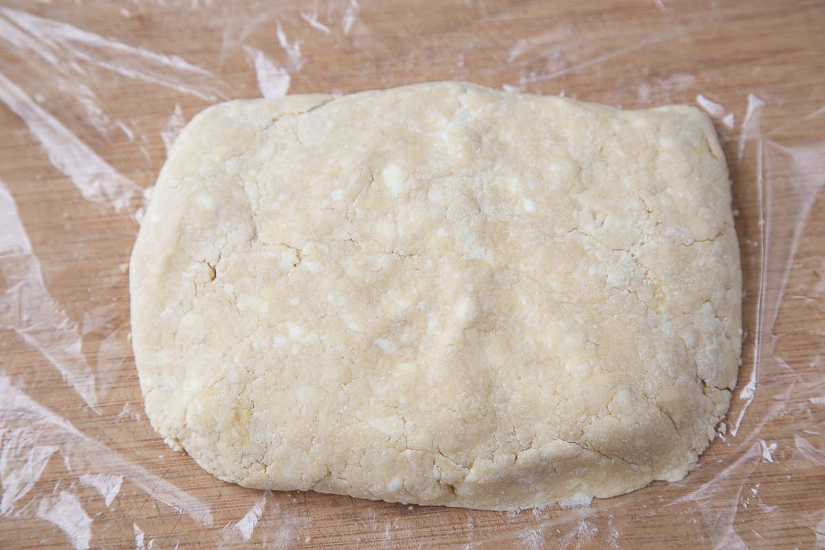 large rectangle of dough on plastic wrap.