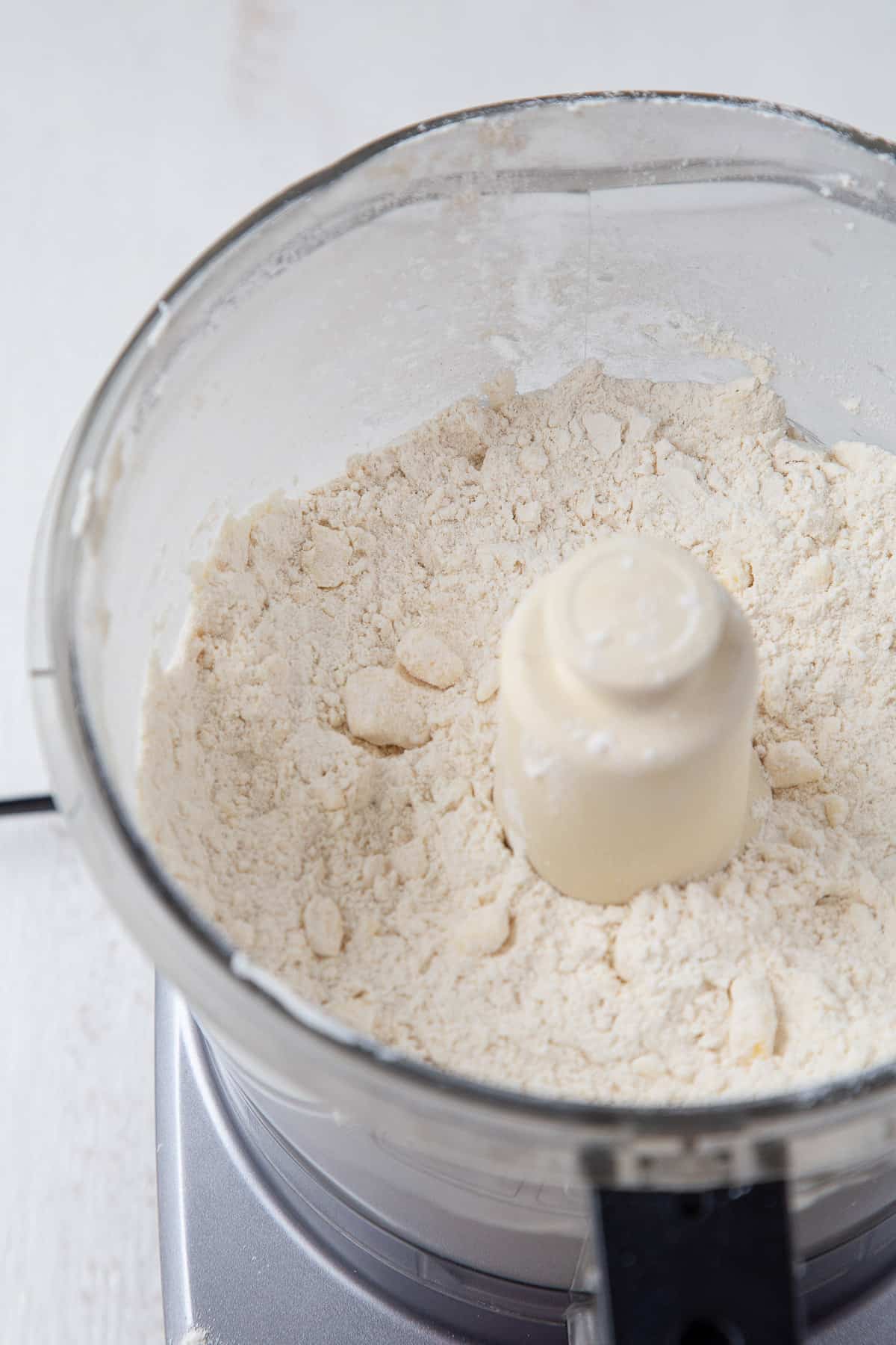 flour and butter in a food processor.
