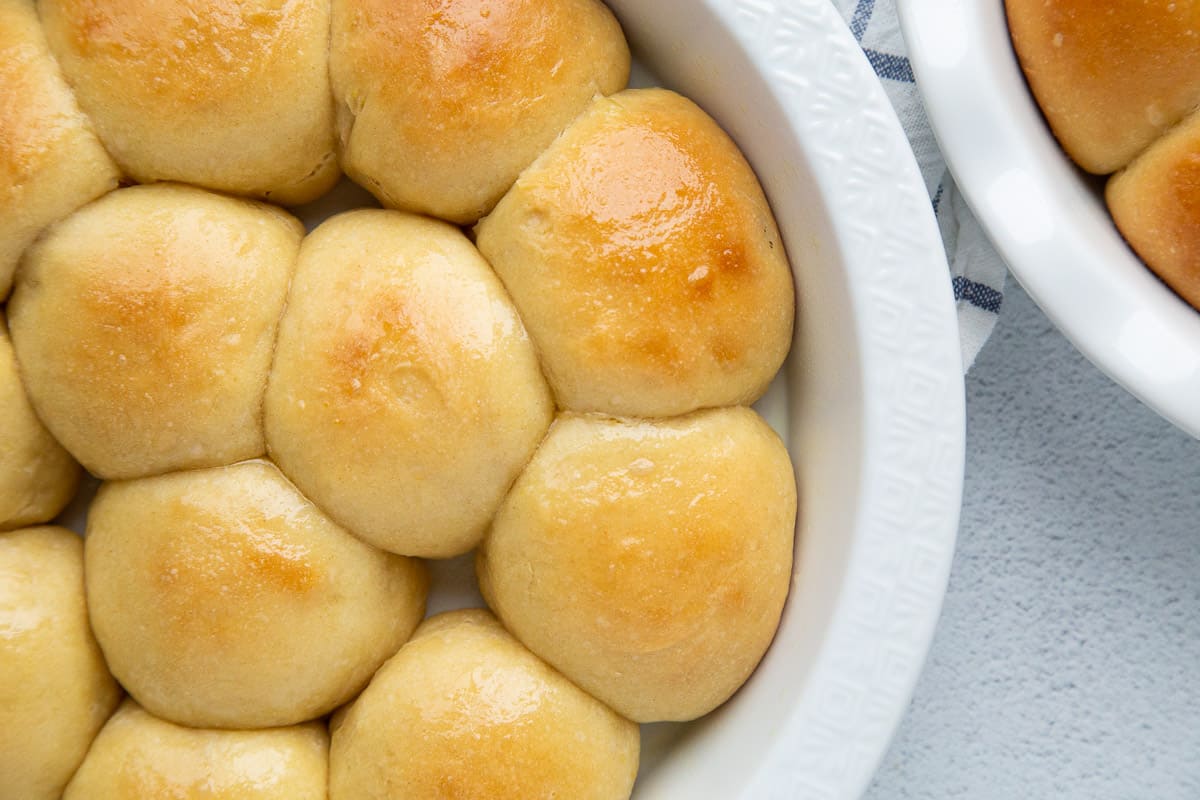 potato rolls crowded into a round cake pan.