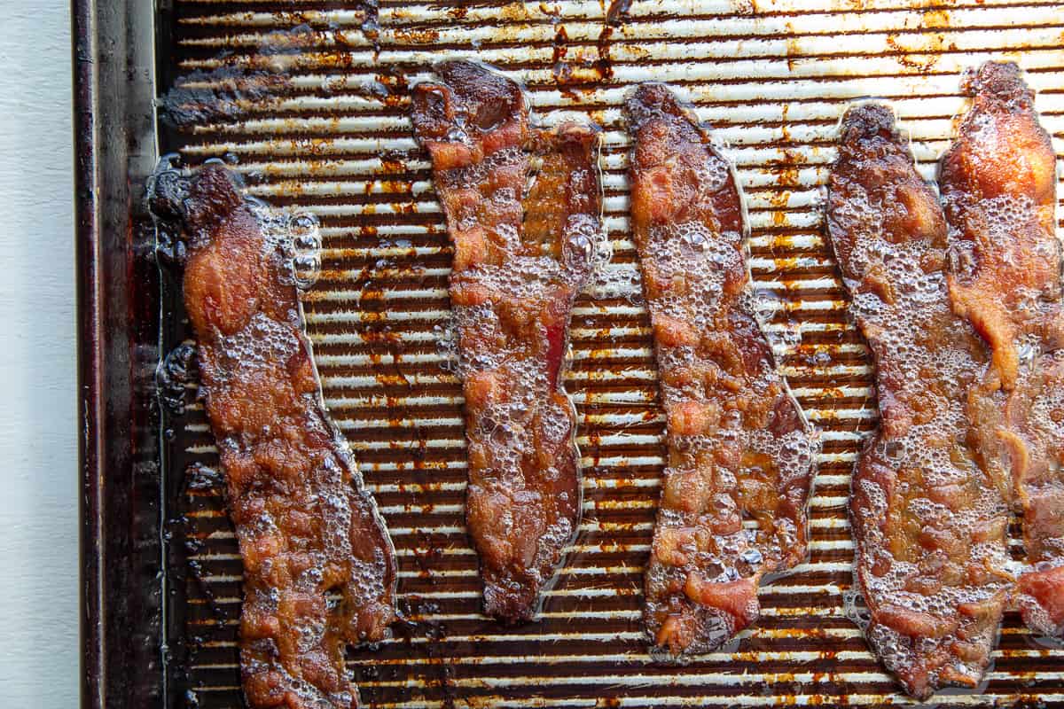 cooked bacon on a sheet pan.