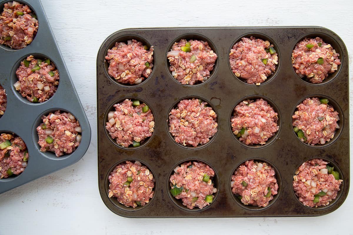 meatloaf mixture packed into muffin tins.