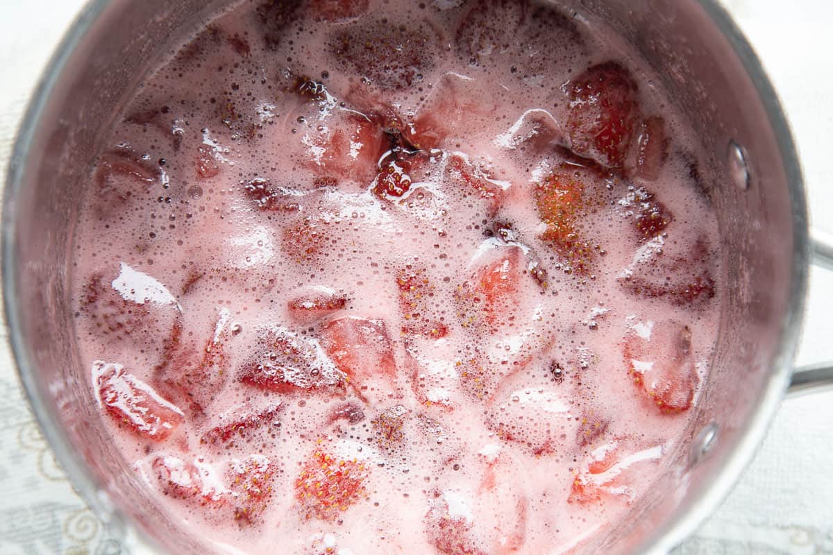 strawberries cooking in a saucepan.