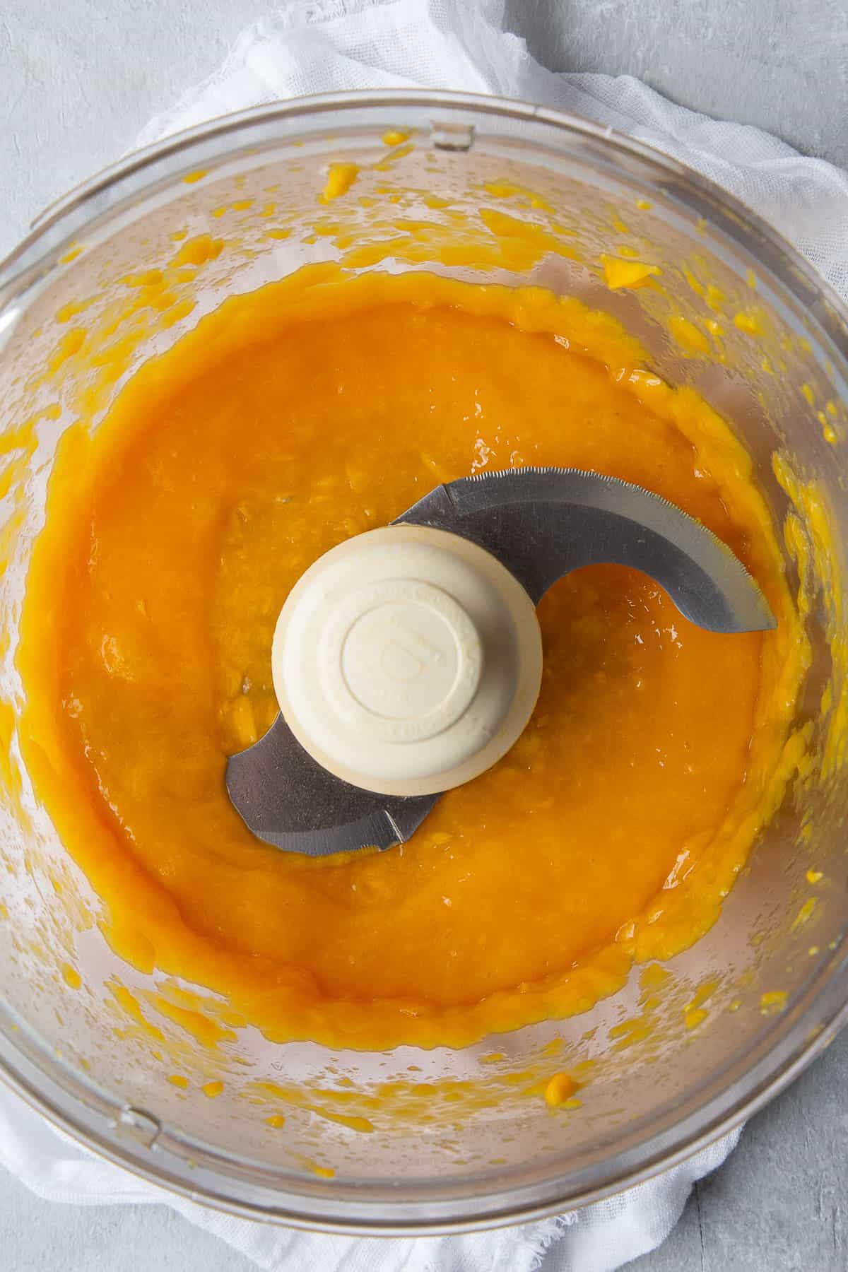 mango purée in a food processor bowl.