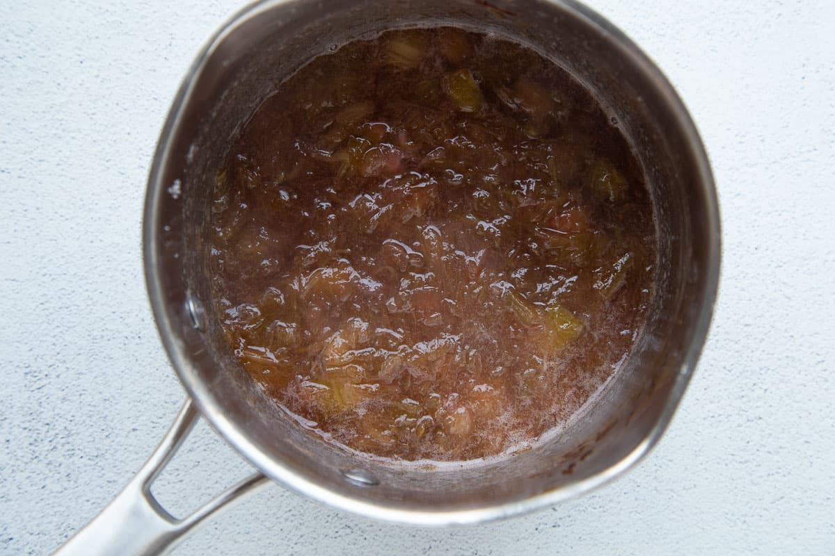 cooked rhubarb sauce in a saucepan.