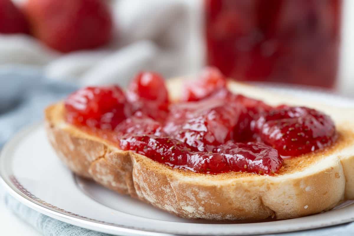 strawberry preserves on a piece of toast.