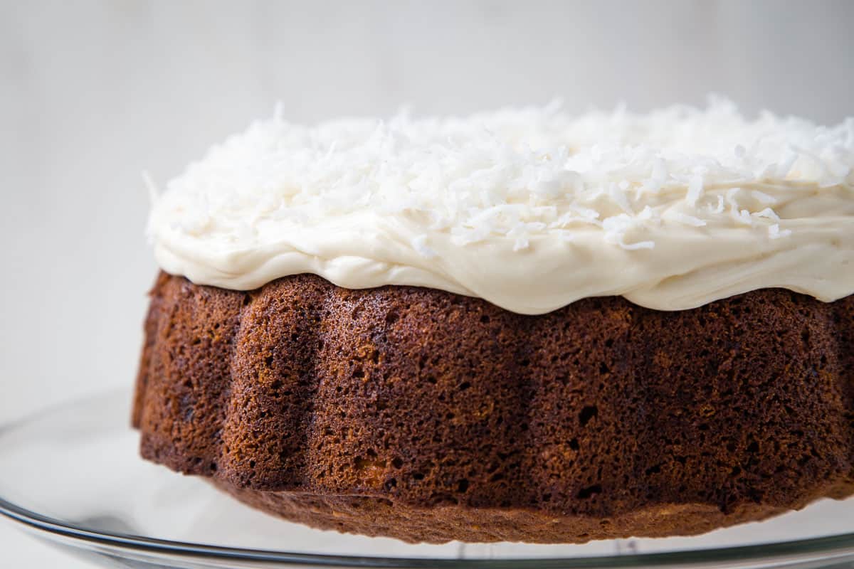 whole hawaiian cake topped with cream cheese frosting and coconut.