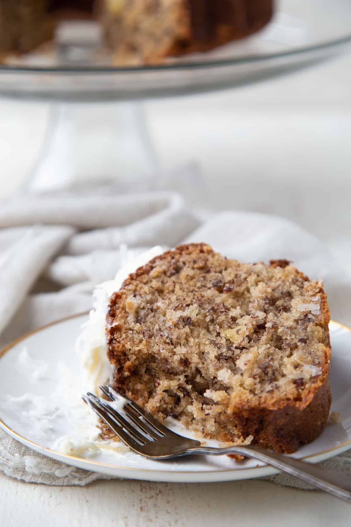 slice of hawaiian cake with a bite taken out.