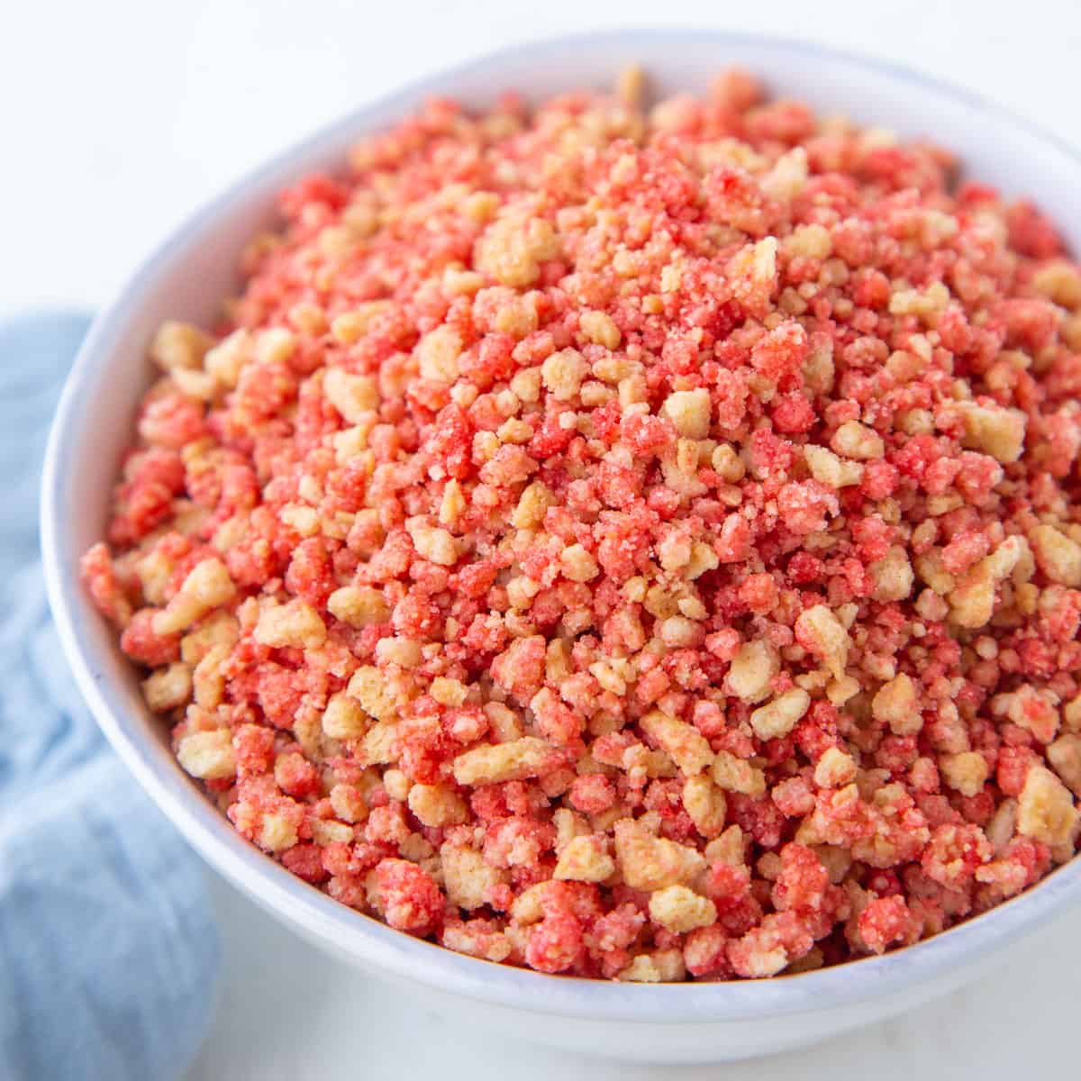 strawberry crunch topping in a white bowl.