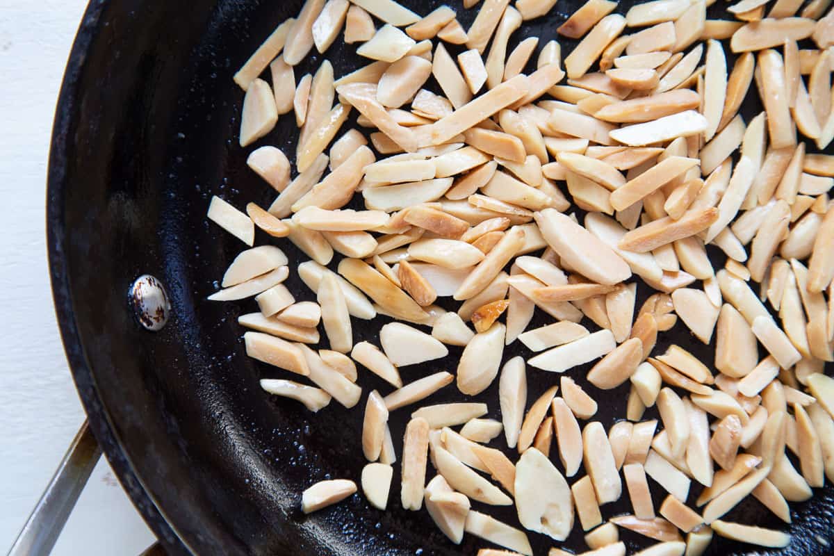 toasted almonds in a skillet.