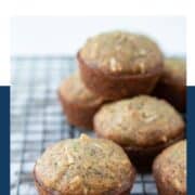 zucchini muffins on a wire rack.