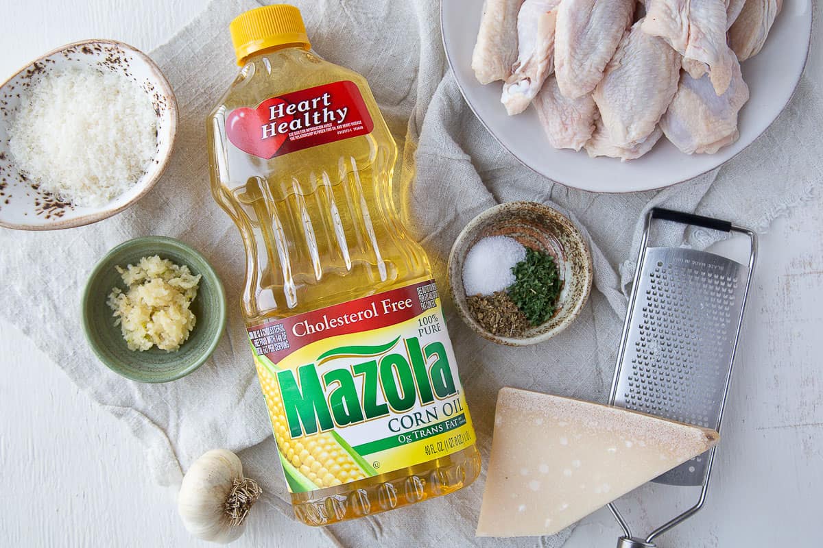 ingredients for grilled wings on a white table.