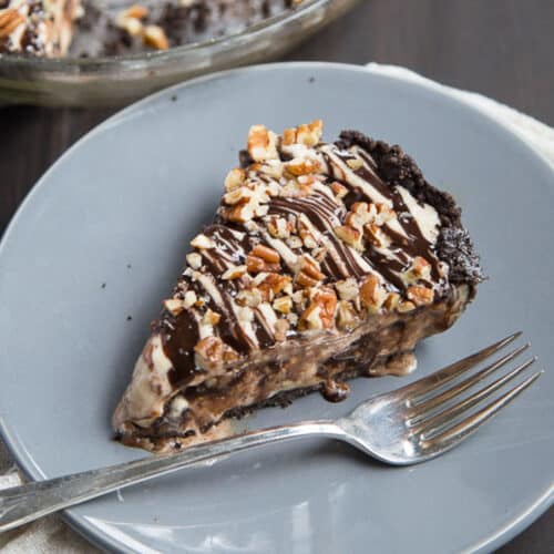 slice of mississippi mud ice cream pie on a gray plate.