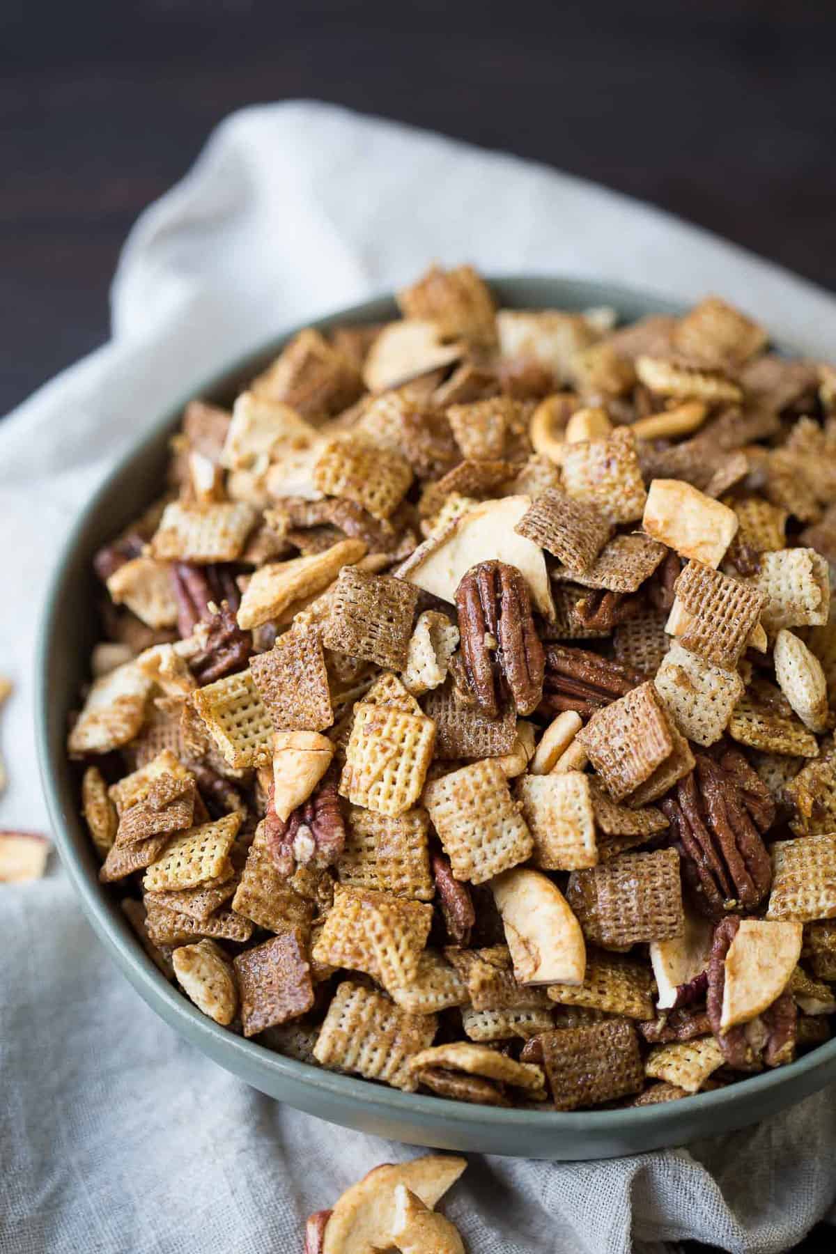 apple cinnamon chex mix in a green bowl.