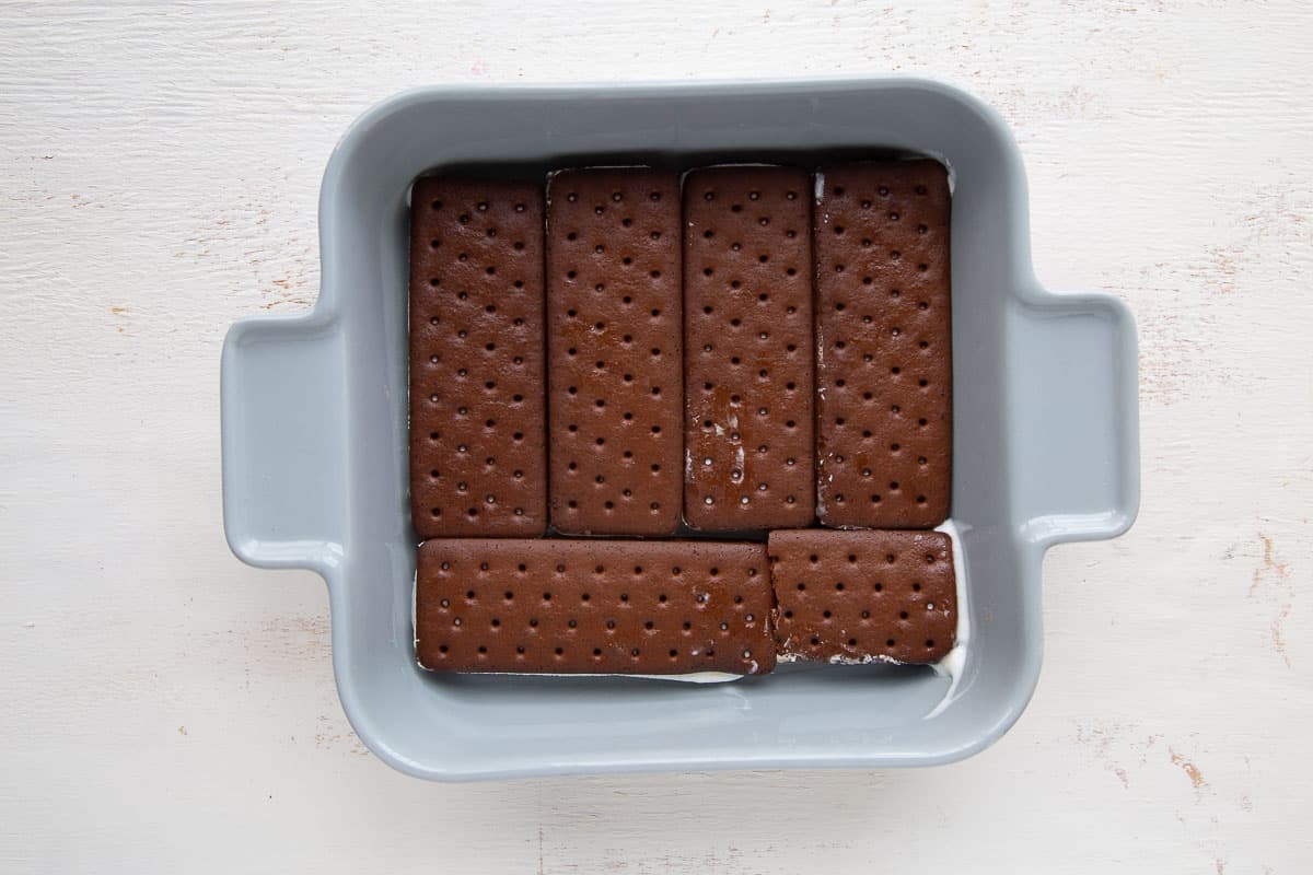 ice cream sandwiches in a blue square casserole dish.