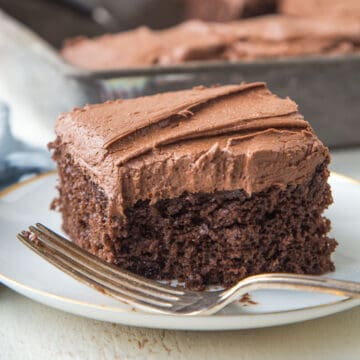 slice of chocolate mayonnaise cake with a bite taken out.