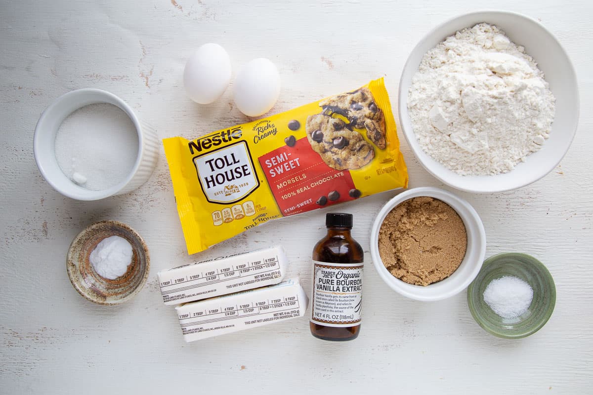 chocolate chip cookie ingredients on a white table.