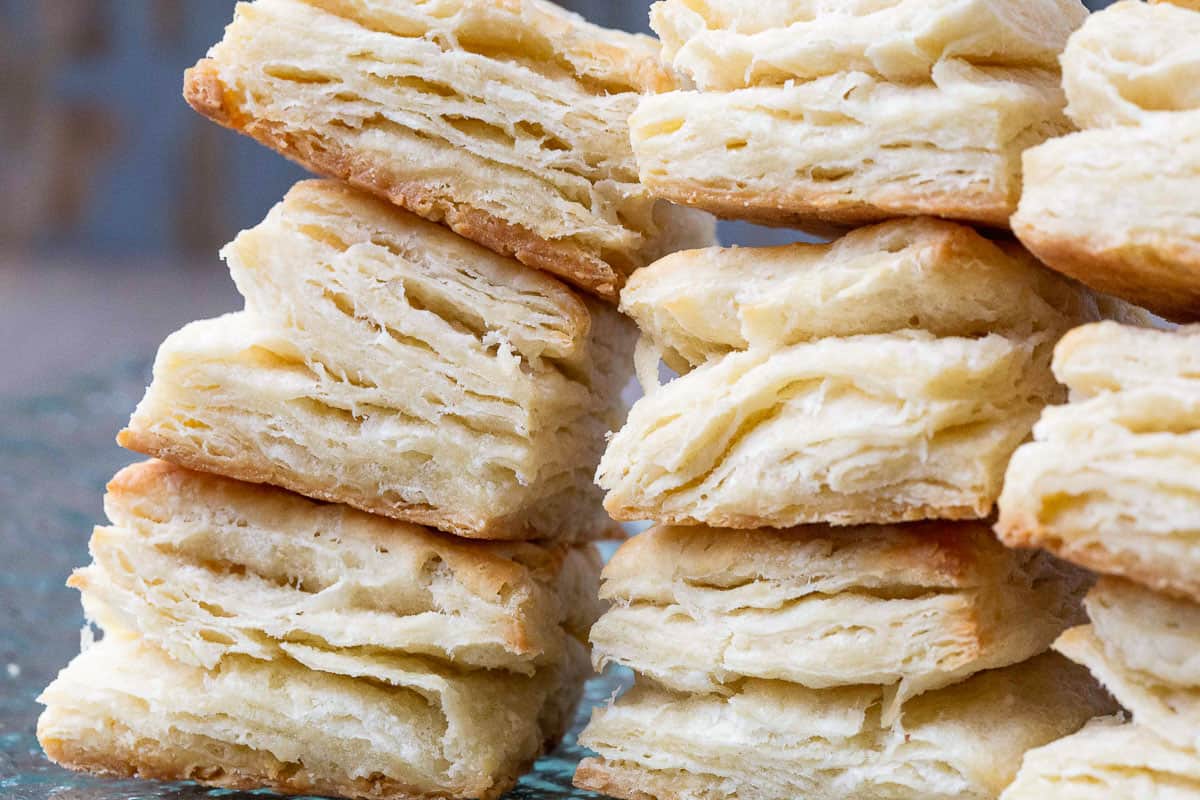 flaky biscuits stacked on one another in rows.