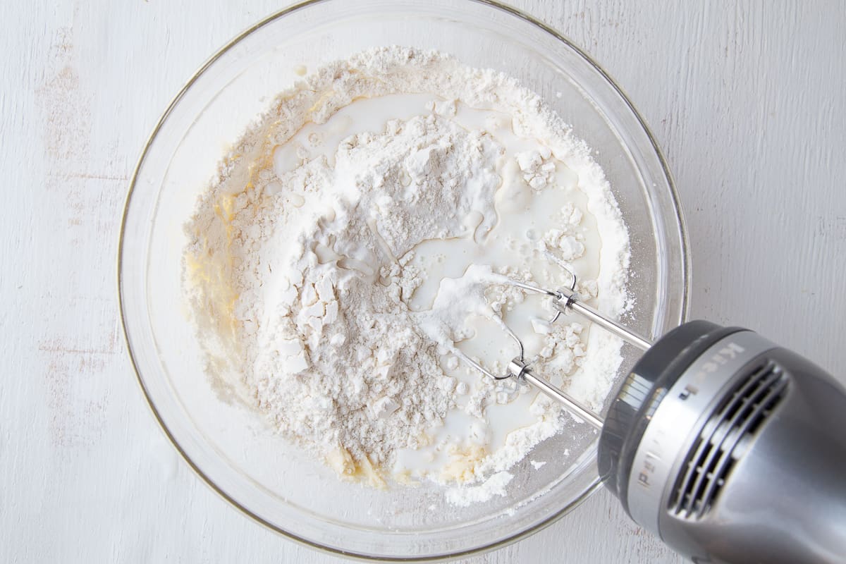 quick bread batter with flour on top in a glass bowl.