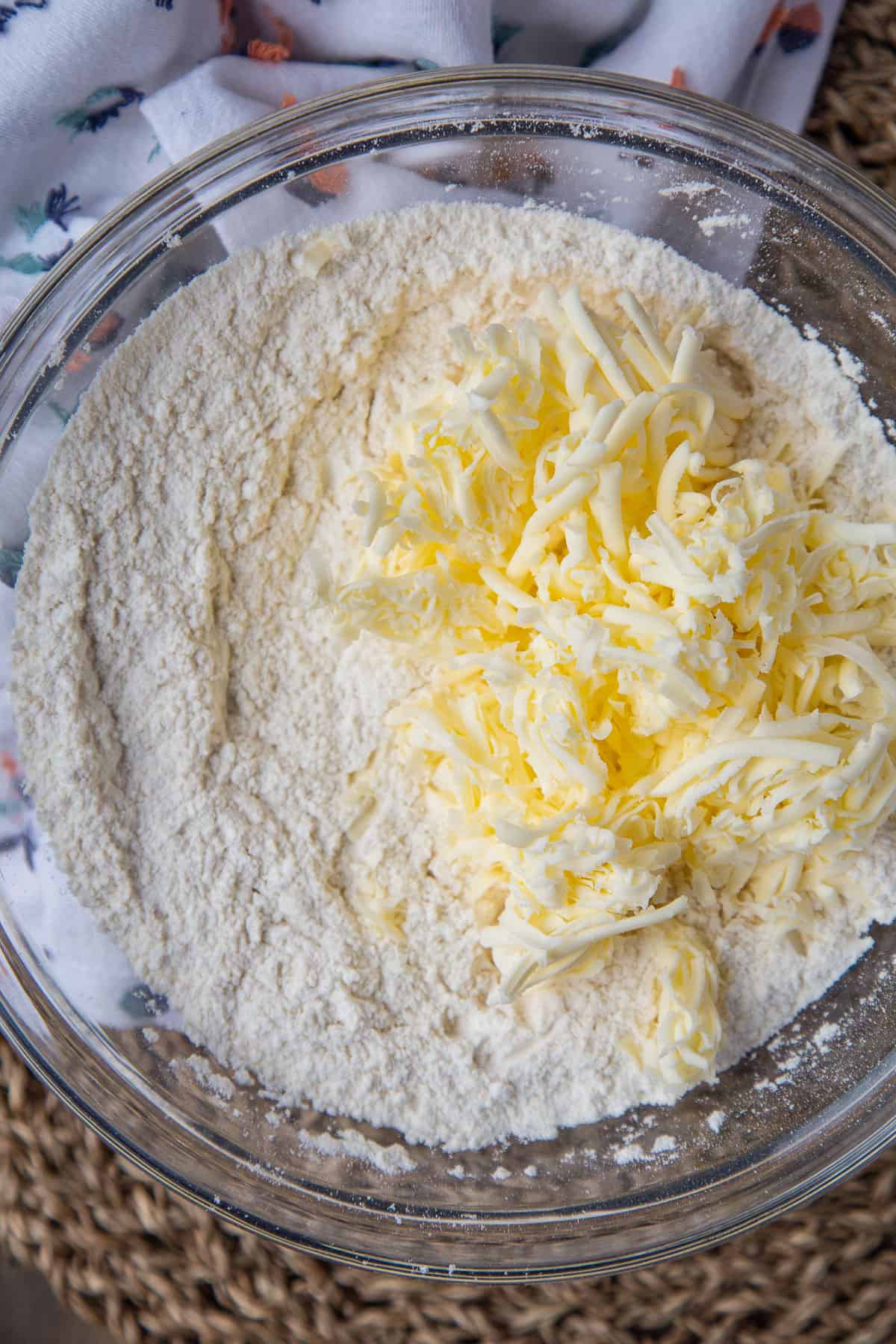 flour and grated butter in a glass bowl.