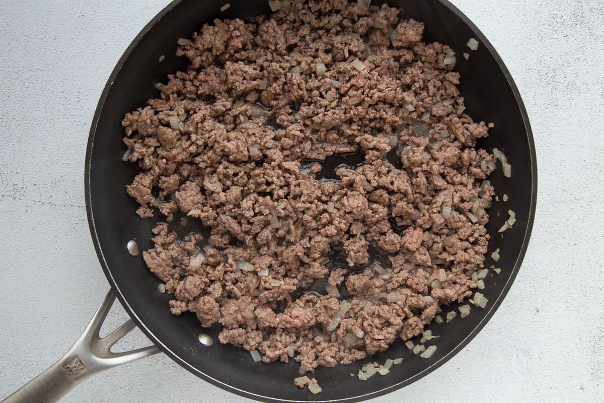 ground beef and chopped onion in a large skillet.